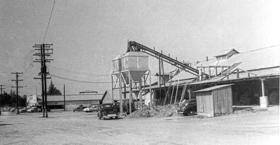 Black and white photo of the first JDH bulk tanks in 1953