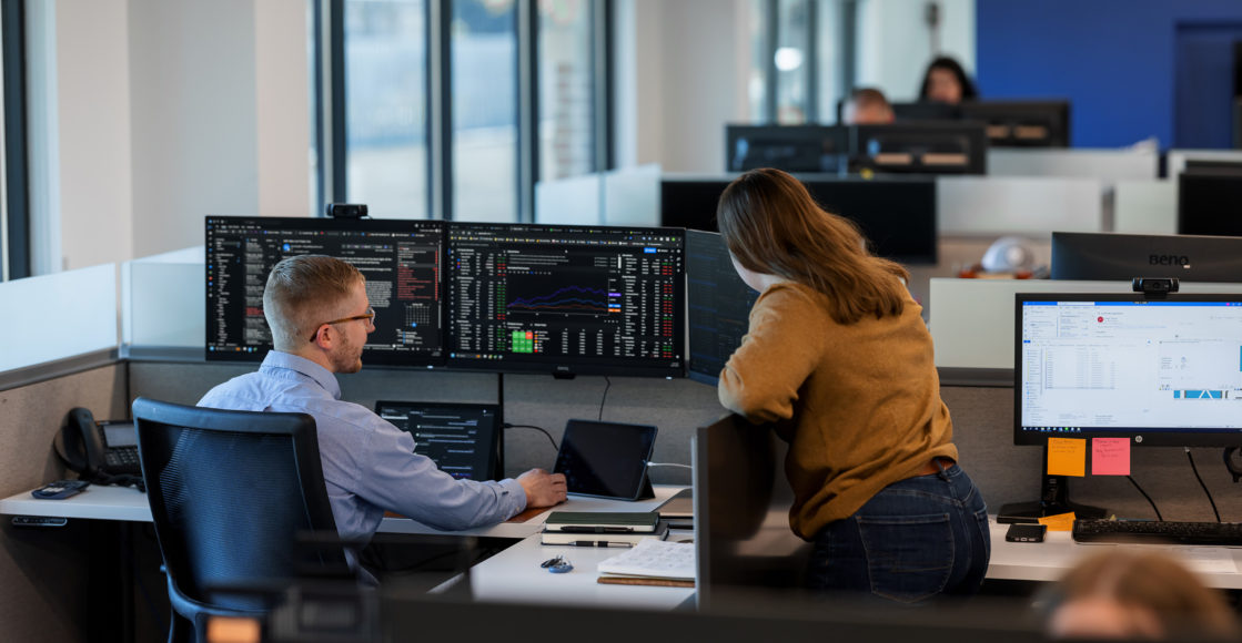 Two JDH traders on the trade floor at JDH headquarters