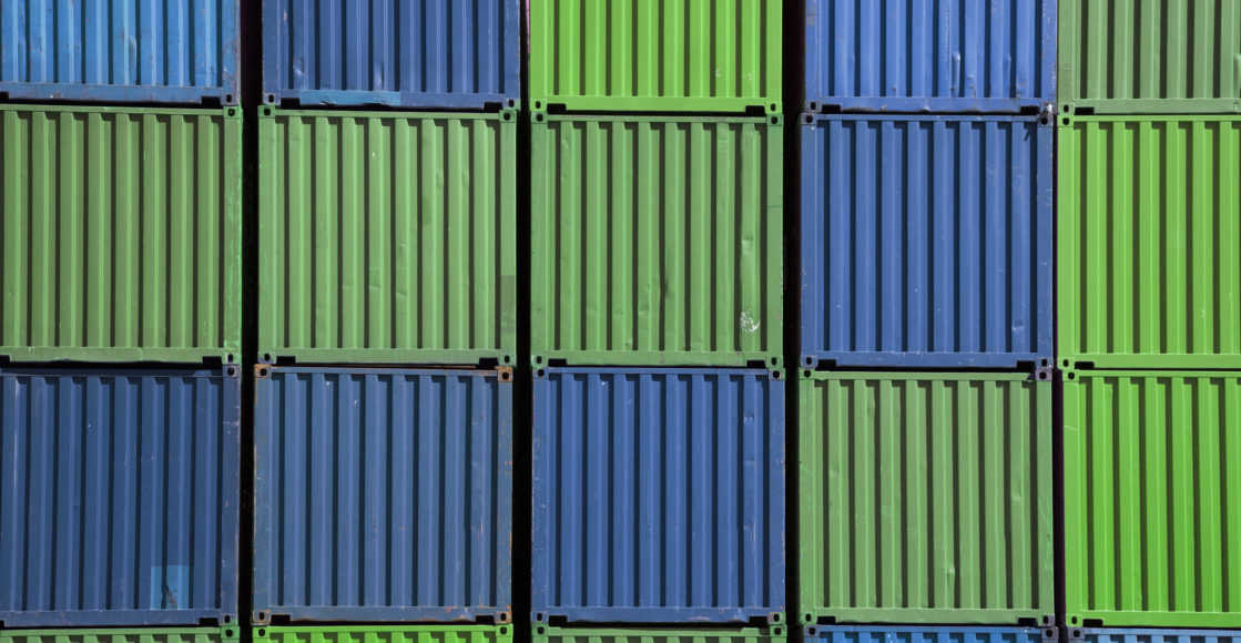 Front view of a group of cargo containers waiting to be loaded
